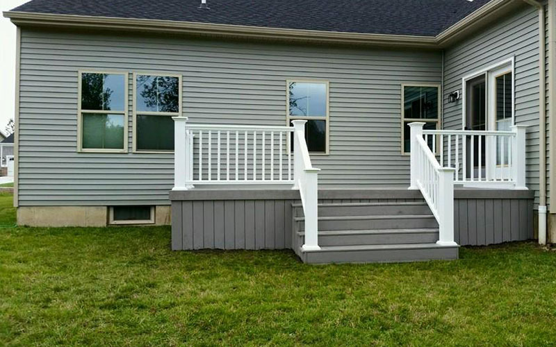 Engineered deck with railing and stairs