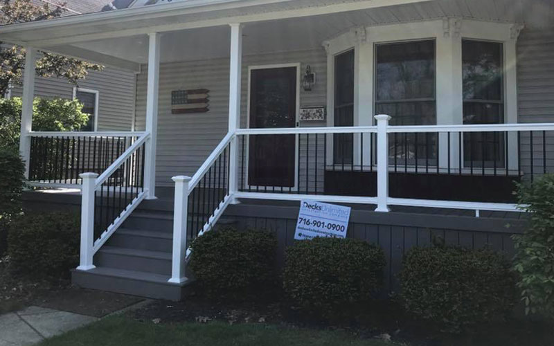 Front porch rehabilitation with railings and stairs