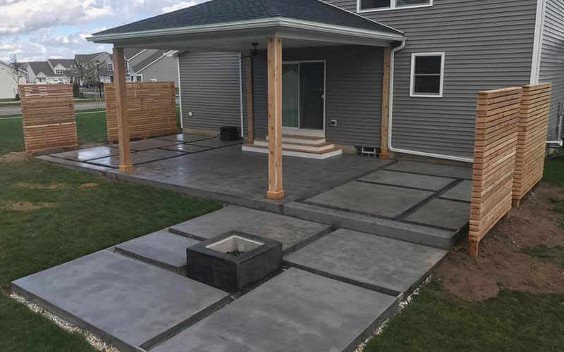 Extended patio with privacy walls and fireplace